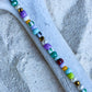 Armbånd med store Seed Beads i lækre lilla og grønne nuancer og med små ferskvandsperler
