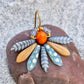 Speciel blomsterørering i blå nuancer med orange glasperle