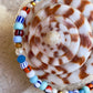 Armbånd med store Seed Beads i dejlige orange, brune og blå nuancer og med små ferskvandsperler