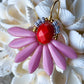 Flot blomster ørering af sjældne rosa glasperler.