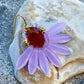 Stor flot blomsterørering i lavendel og lyse brune farver