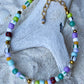Armbånd med store Seed Beads i lækre lilla og grønne nuancer og med små ferskvandsperler