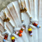 Hvid og multifarvet ørering med store og små seed beads i