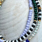 Armbånd med lys lilla og grønne seed beads