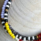 Armbånd med gul, rød og lilla seedbeads