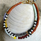 Armbånd med brun, grøn og lilla seed beads