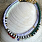 Armbånd med lys lilla og grønne seed beads